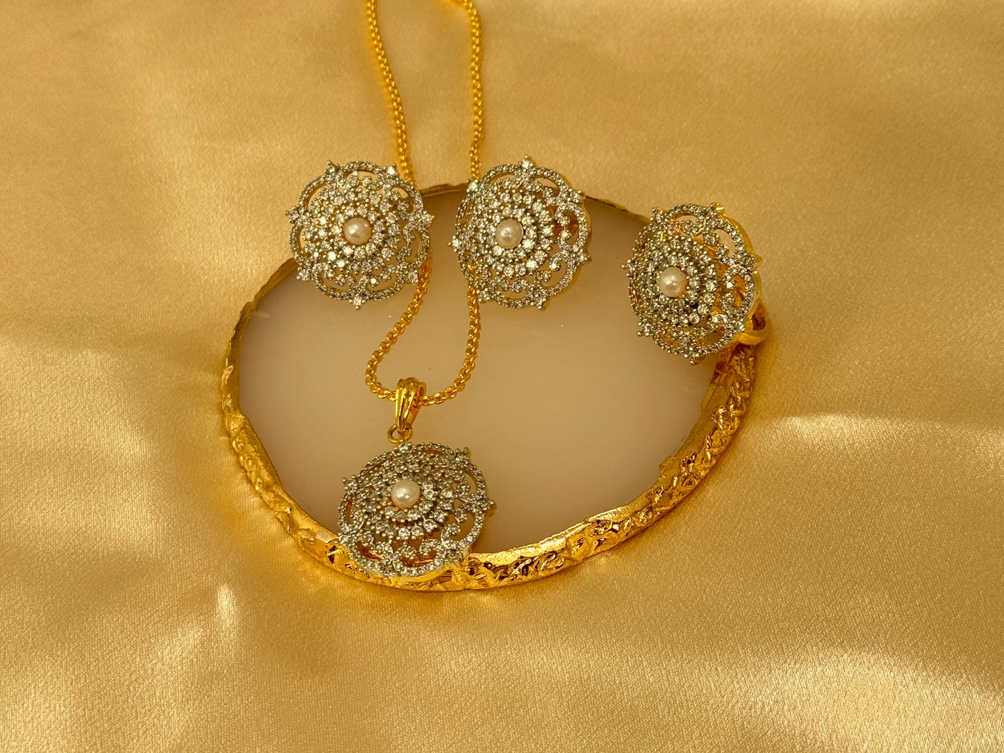 American diamond gold plated pendant set with matching ring and a complimentary chain