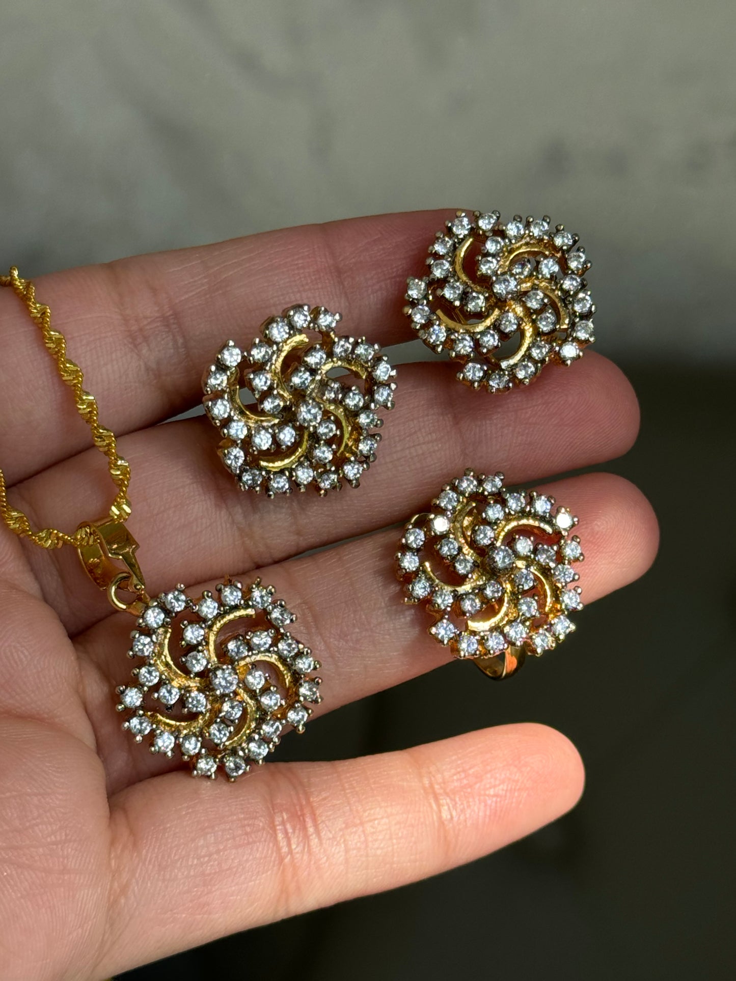 Floral shaped american diamond gold plated pendant set